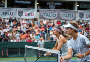 Tennis players from Marquette University competing in a match