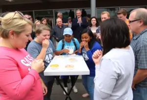 Participants at the Milwaukee Donut Smackdown eating mini donuts